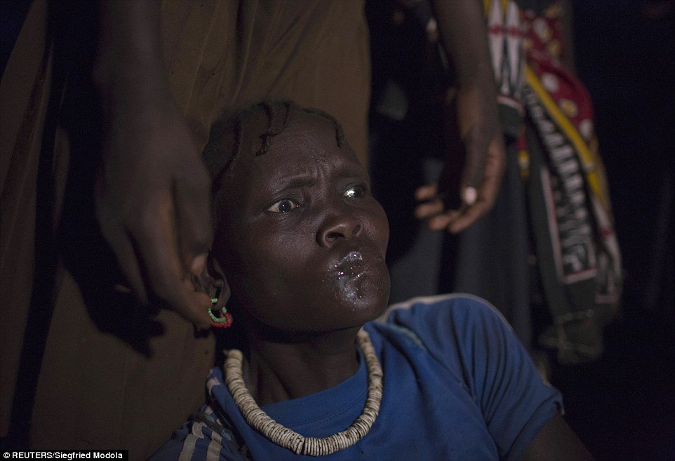 Trance: A Pokot woman falls into a trance after drinking a local brew and dancing during a female circumcision ceremony
