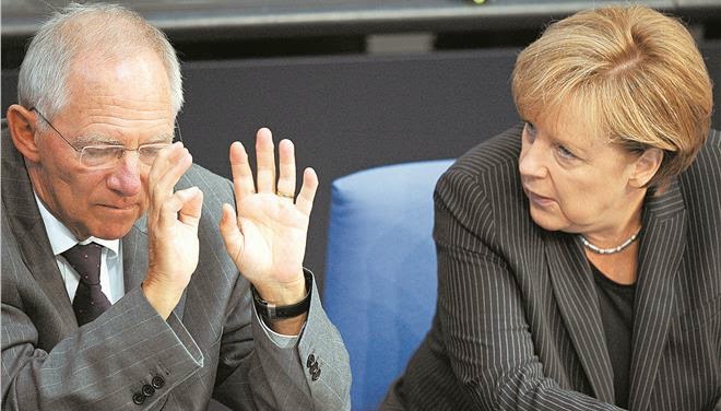 Bild: Δυσαρέσκεια Σόιμπλε για την ευχή της Μέρκελ  - Διαβάστε τους όρους του Γερμανού ΥΠΟΙΚ για συμφωνία
